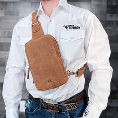Full-grain brown leather CCW sling bag with hidden magnetic back pocket