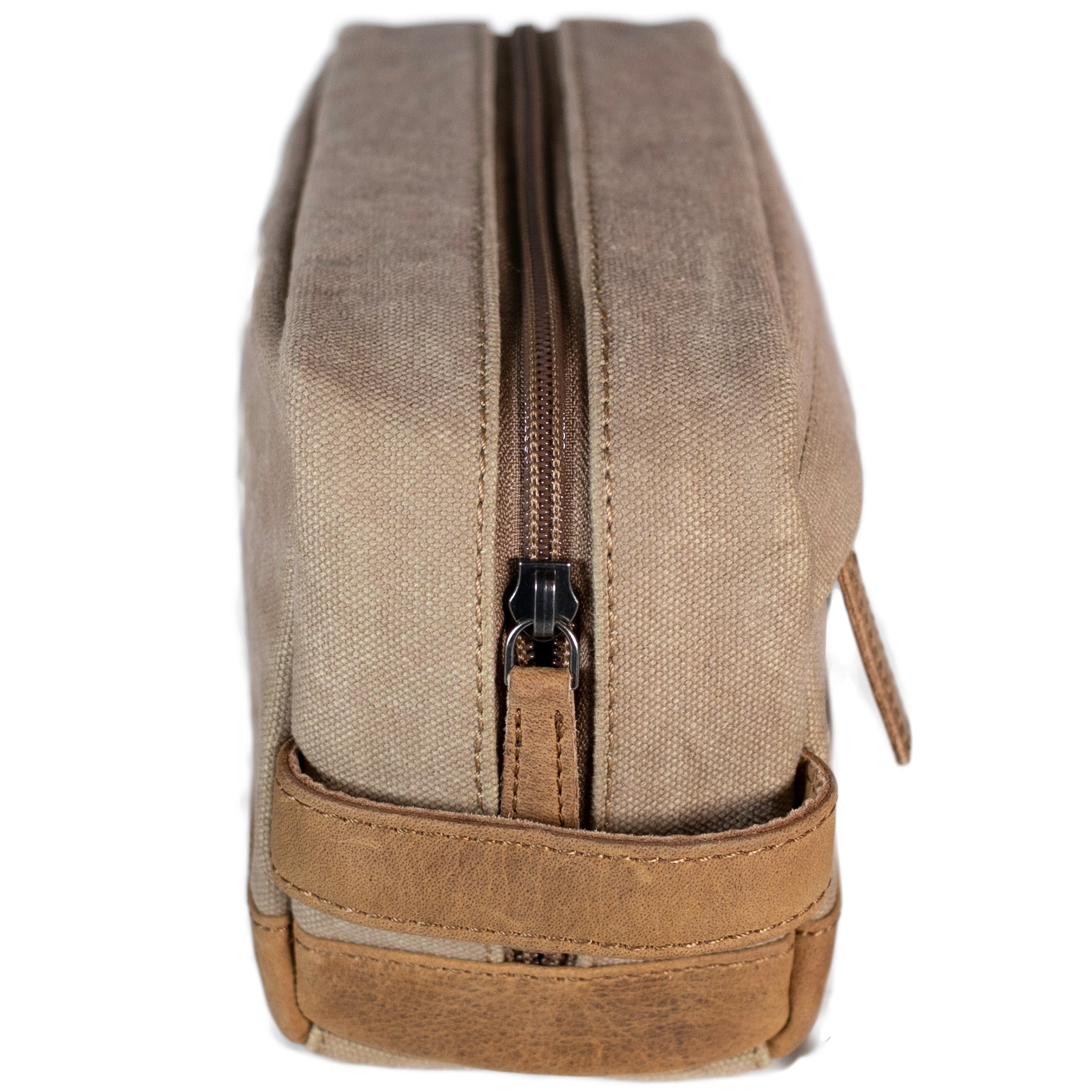 A brown canvas toiletry bag  and leather details, featuring a zipper closure and a brand logo embossed on the front.