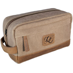 A brown canvas toiletry bag  and leather details, featuring a zipper closure and a brand logo embossed on the front.